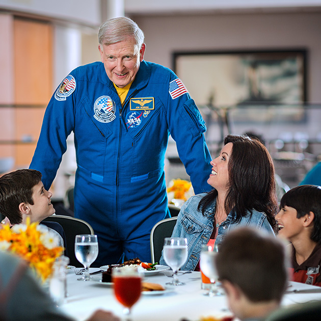 Astronaut Jon McBride with lunch guests