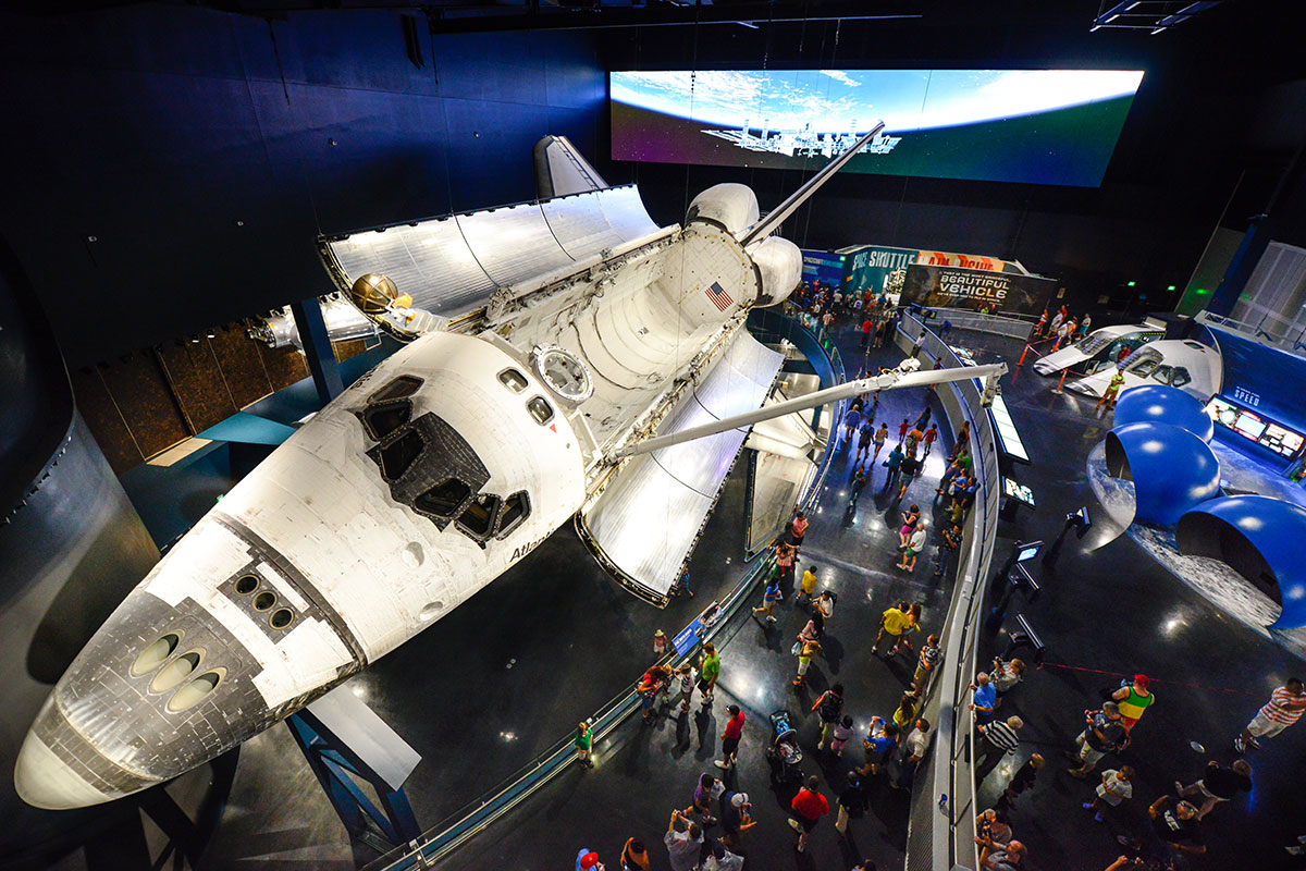 View of the space shuttle Atlantis exhibit from above, with the shuttles cargo bay doors open