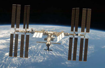 View of the International Space Station above Earth.
