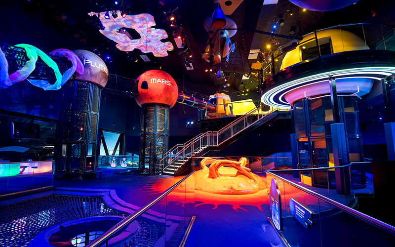 The second floor in Planet Play at Kennedy Space Center Visitor Complex features Mercury, Pluto, Mars and the Sun.