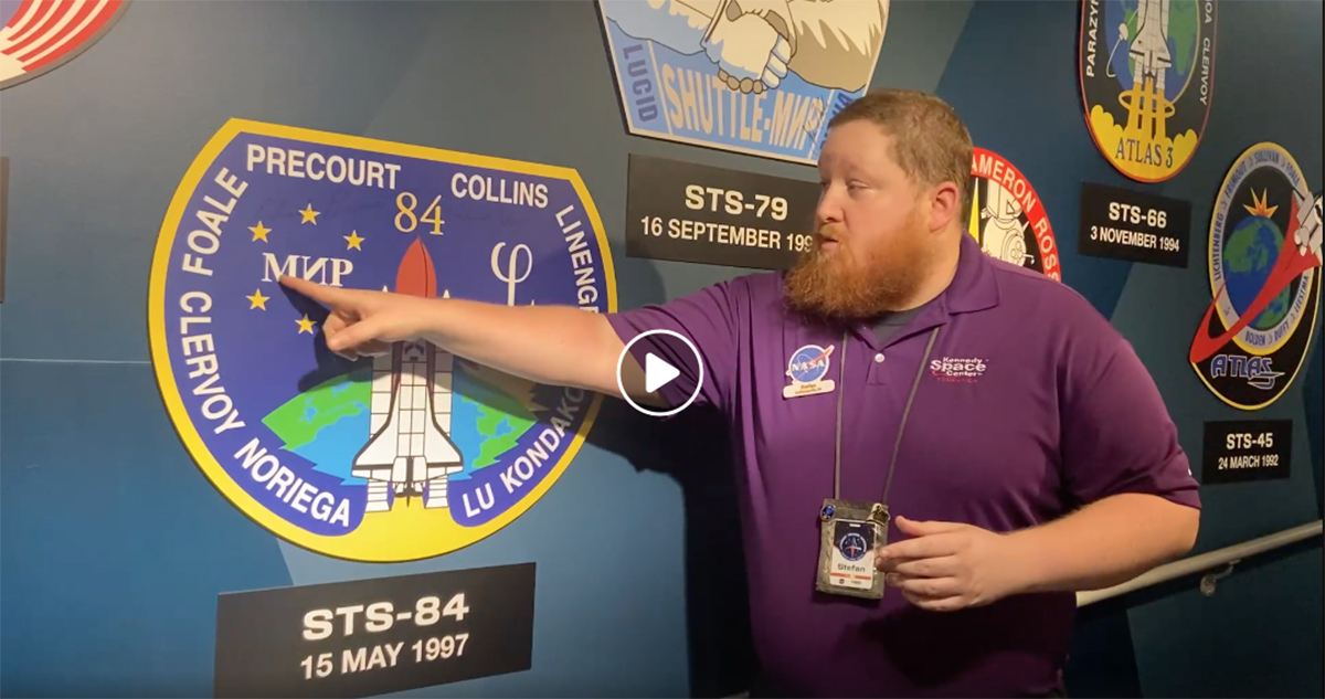 Kennedy Space Center Visitor Complex educator speaks about mission patches in one of the educational videos.