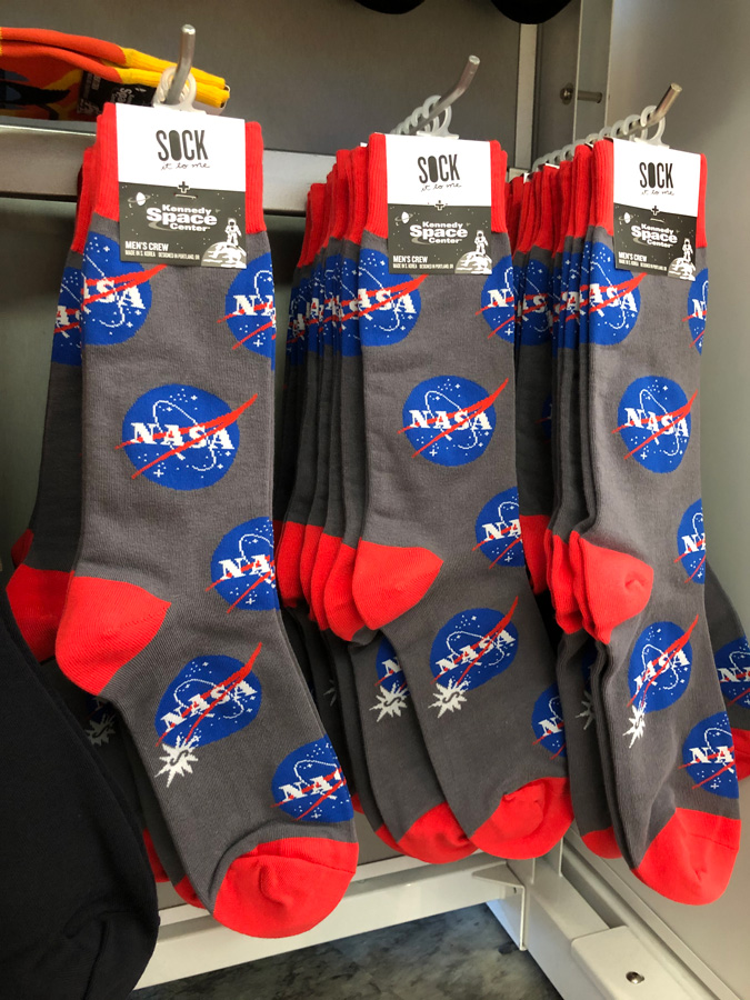 Gray socks with the NASA logo on them