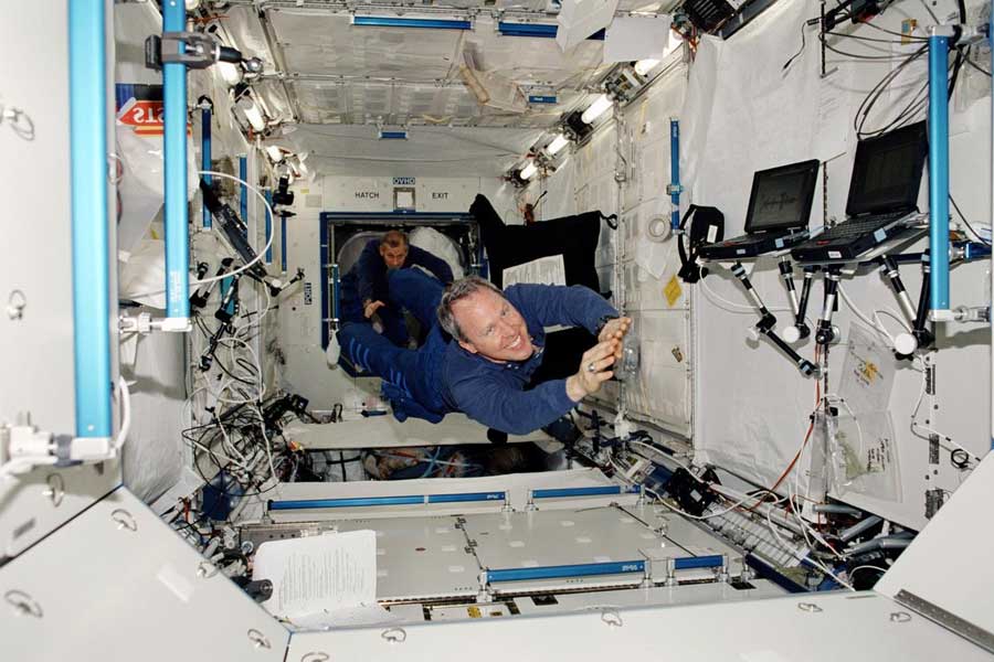 STS-98 astronauts Thomas D. Jones and Kenneth D. Cockrell inside the International Space Station.