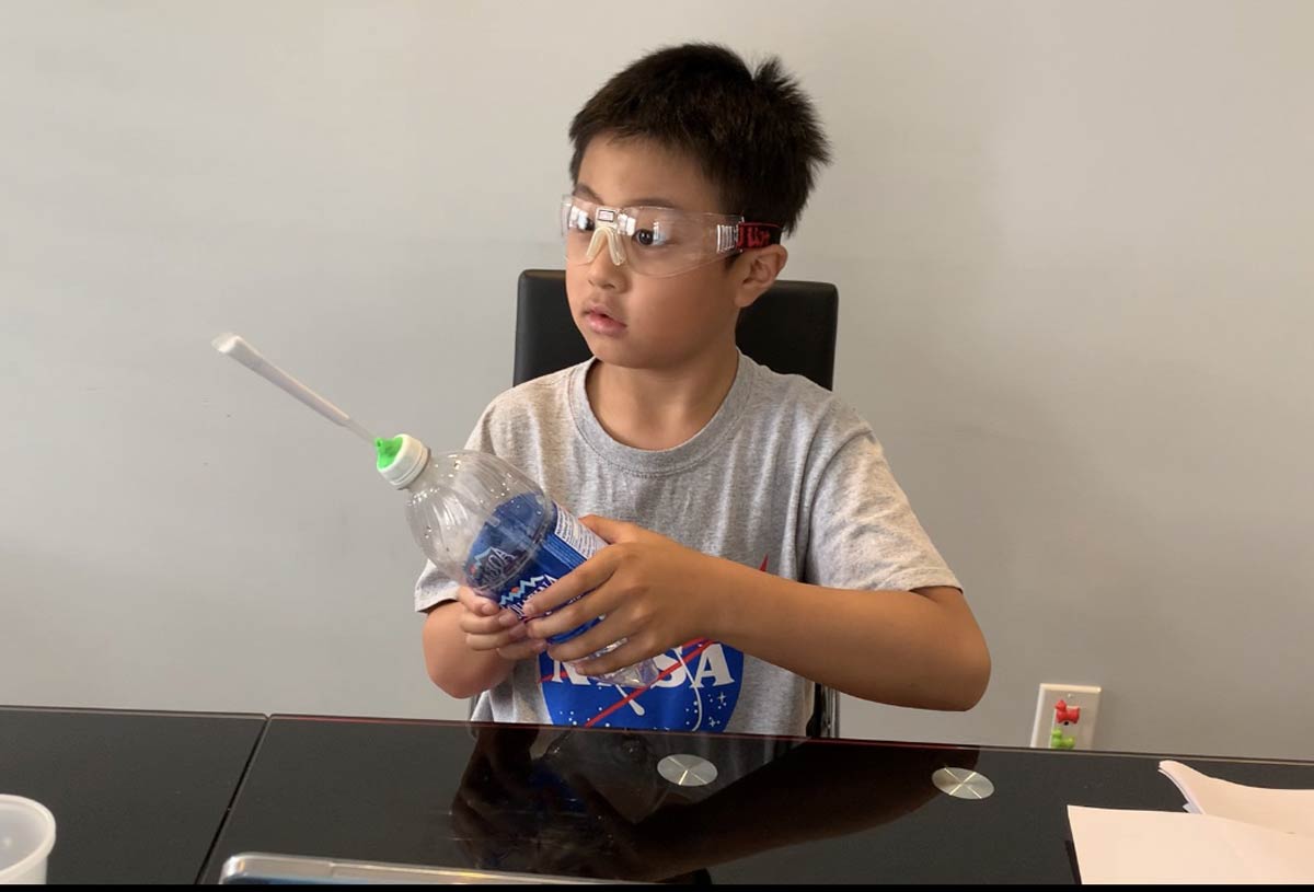 Child doing a science experiment