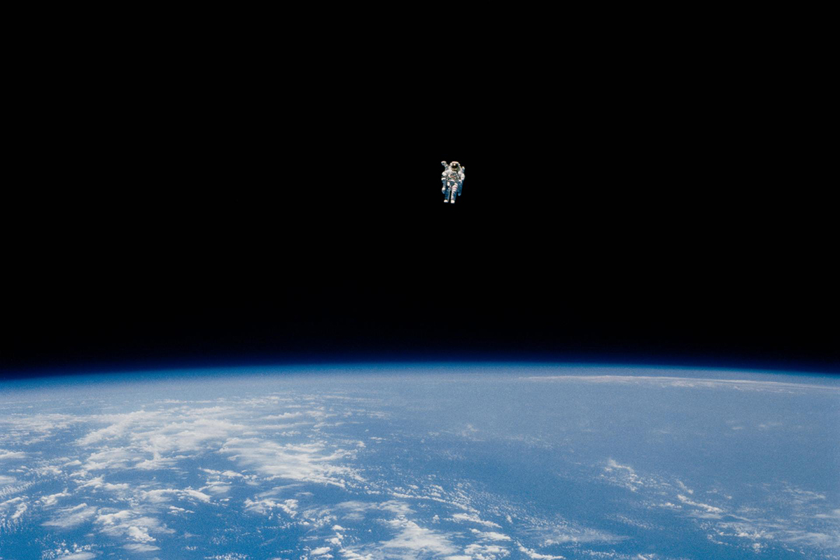 Astronaut Bruce McCandless performs the first untethered spacewalk.