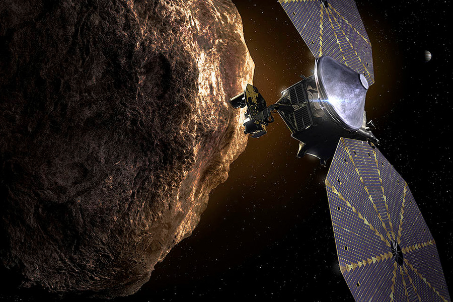 his illustration shows the Lucy spacecraft passing one of the Trojan Asteroids near Jupiter.
