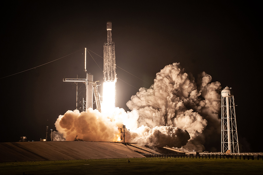 SpaceX Falcon Heavy lifting off from LC39-A at night