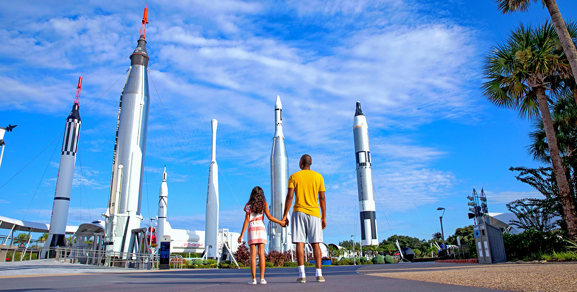 Father and daughter look up at the Rocket Garden at the Kennedy Space Center Visitor Complex where Rockets launch and inspiration begins.