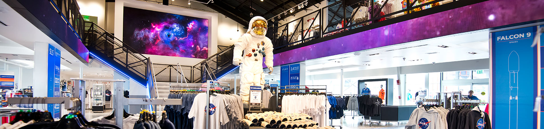 The Space Shop at Kennedy Space Center Visitor Complex features with a large selection of souvenirs, interactive features, and the real Apollo 11 gantry.